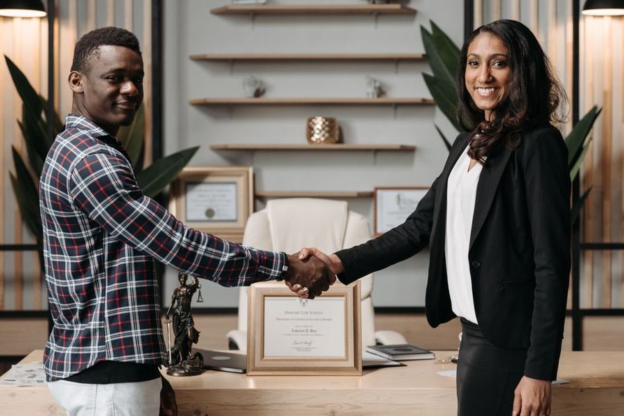 Attorney greeting clients in a law office