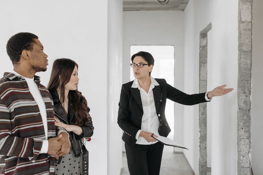 Real estate agent showing a home to a couple